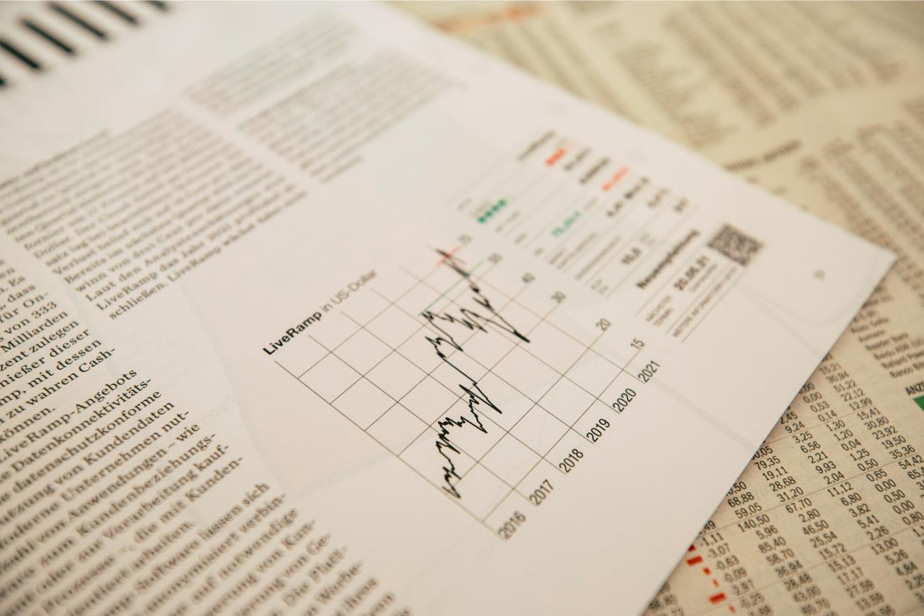 Newspaper chart displaying economic trends and fluctuations.