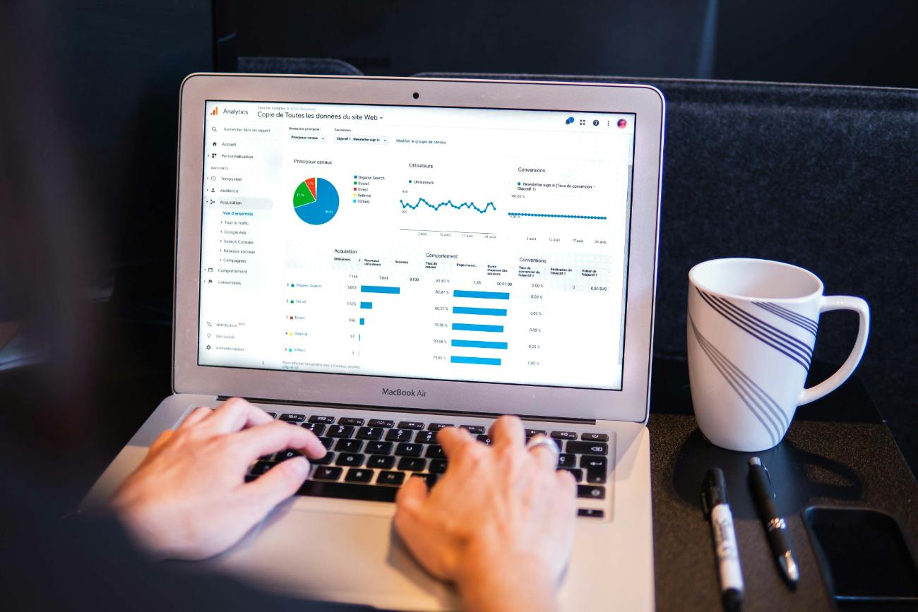 Analyzing web traffic and metrics on laptop.